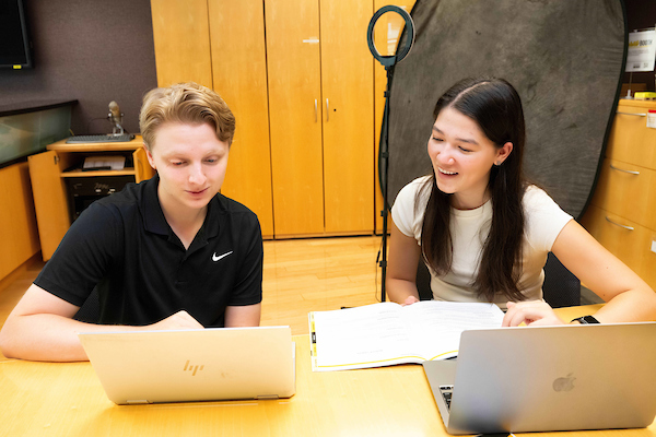 Peer advisor talking to a student