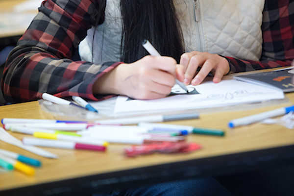 Close-up of student coloring