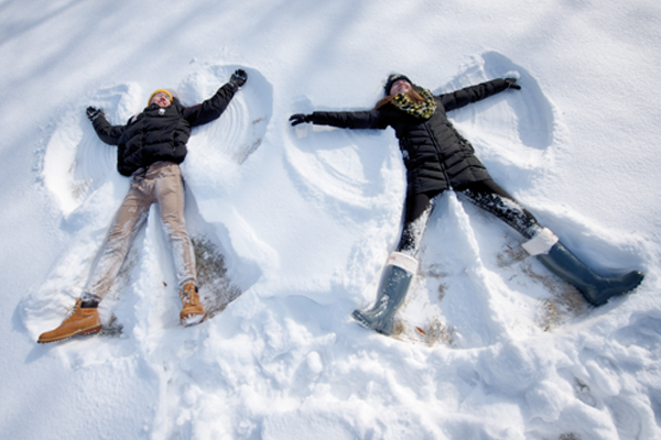 Two students making snow angels