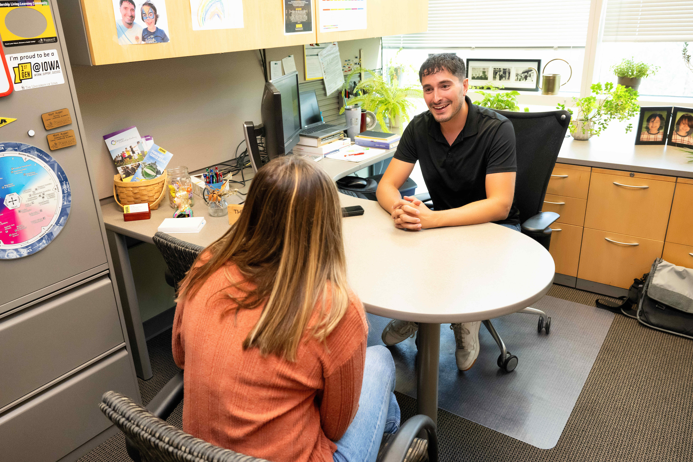 Matt Augeri sits with a student to help advise