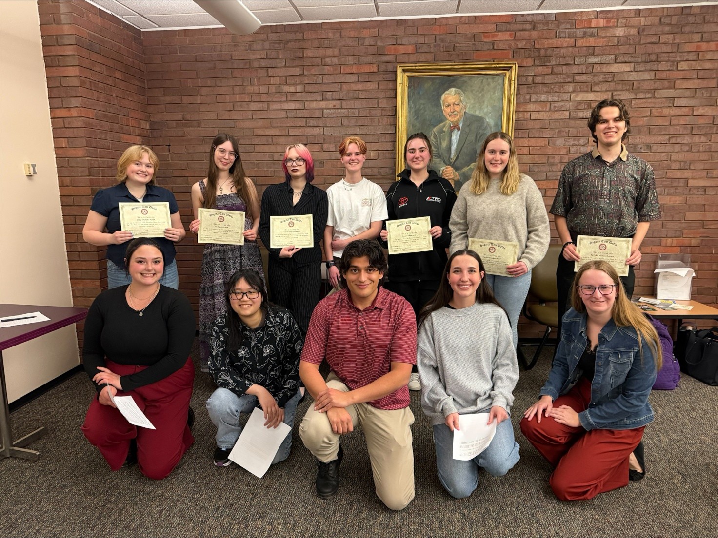 Photo of students holding certificates