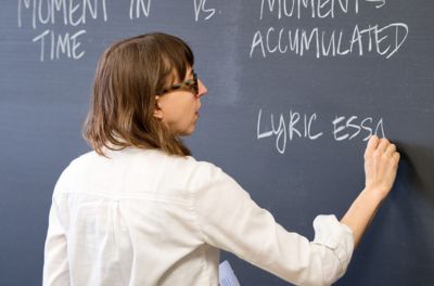 CLAS instructor at chalk board