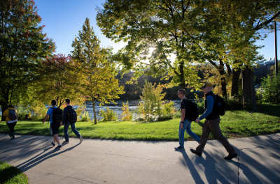 People walking along the river
