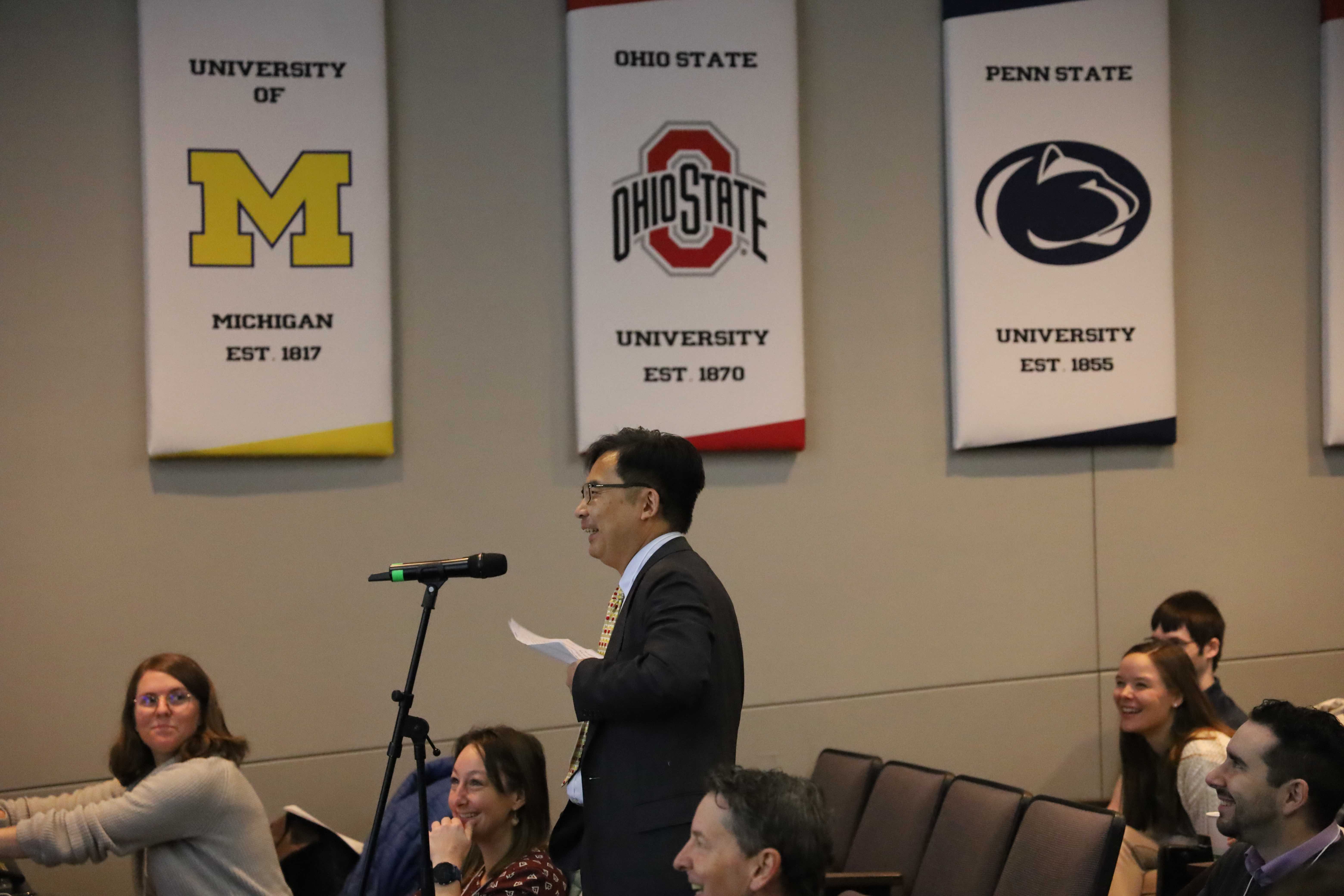Man speaks at podium