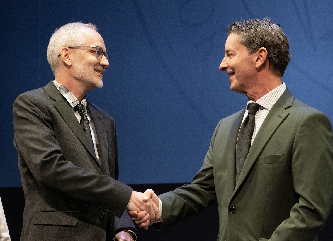 two men shaking hands