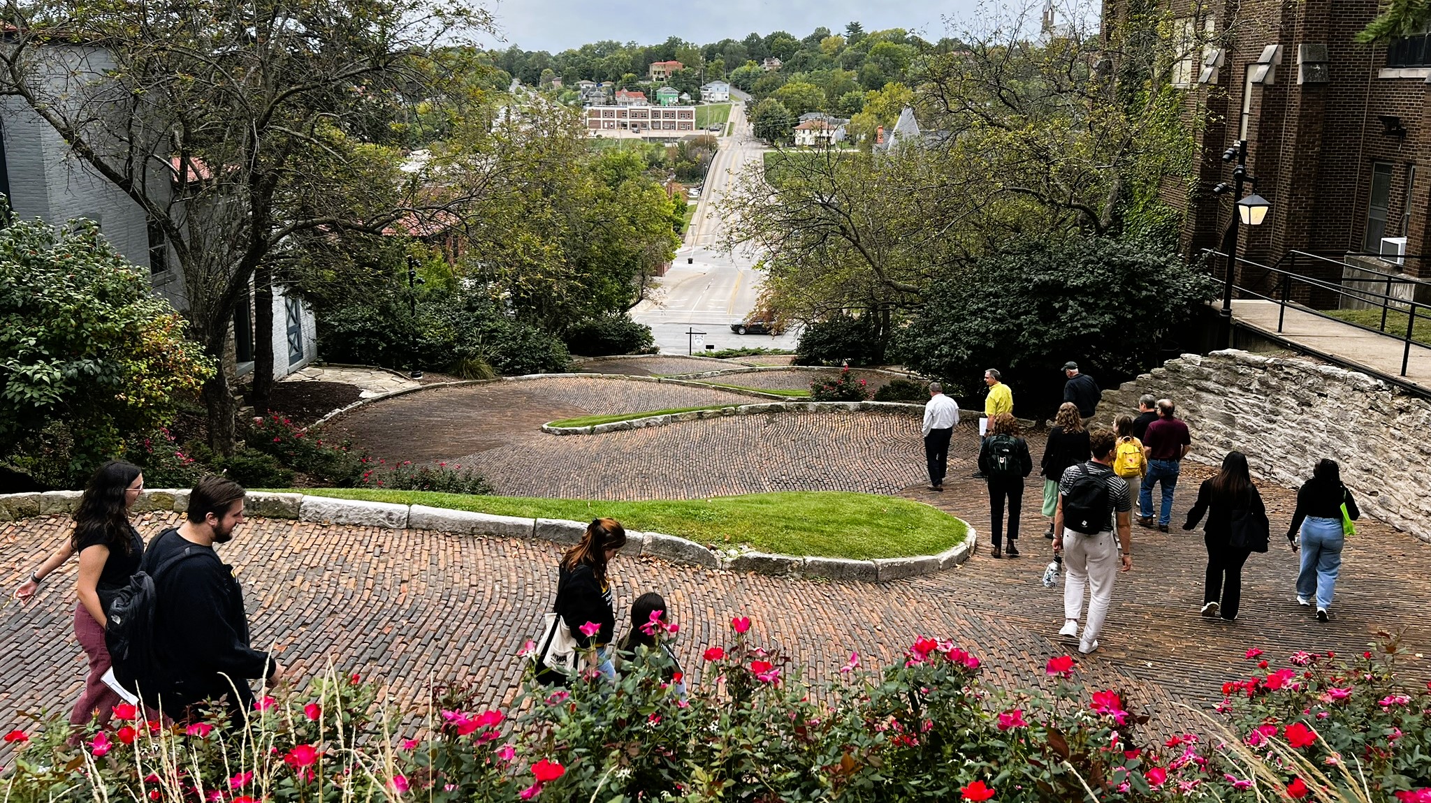 People walking down a curvy street