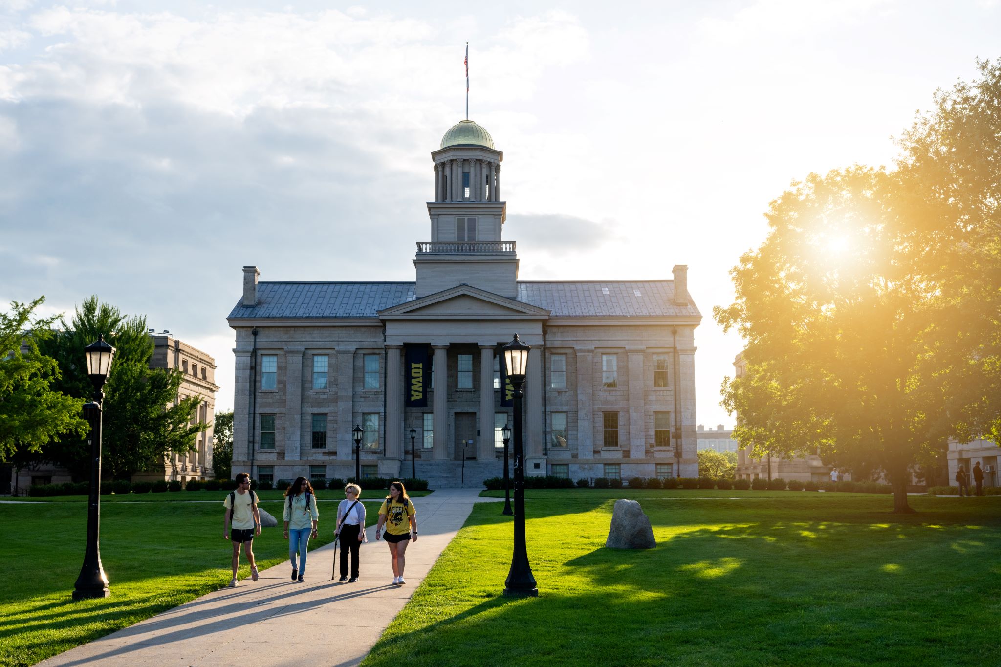 Students walking on the Pentacrest during the summer