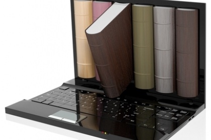 Image of hard copy textbooks coming out of a laptop. 