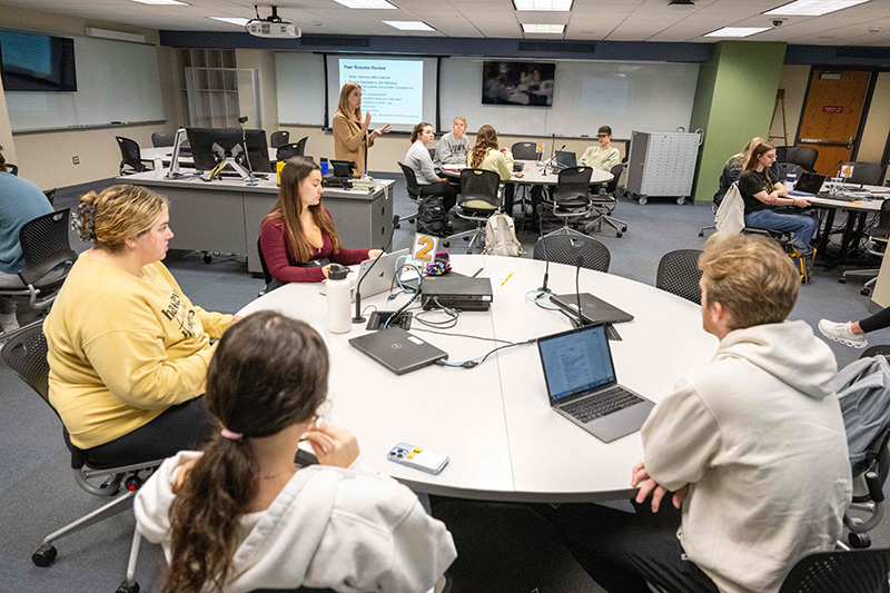 UI students learning in a TILE classroom.