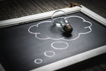 Lightbulb on a chalkboard. 