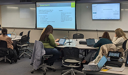 UI faculty and staff attend a monthly brainstorm session in a TILE classroom.