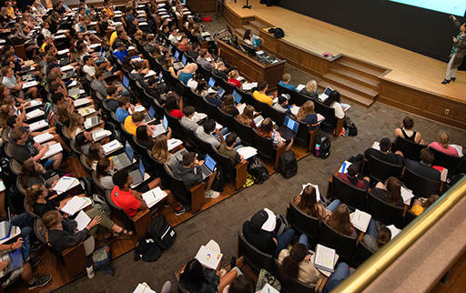 Aerial view of UI students sitting in a large lecture course.in Macbride Auditorium
