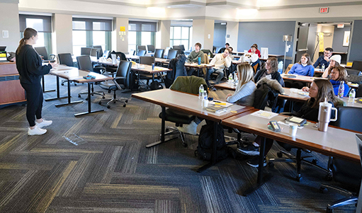 UI students participate in a story lab in a Tippie classroom.