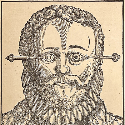 Black and white illustration of a sixteenth century man with curly hair and ruffled collar with two ornate needles going into each eye.