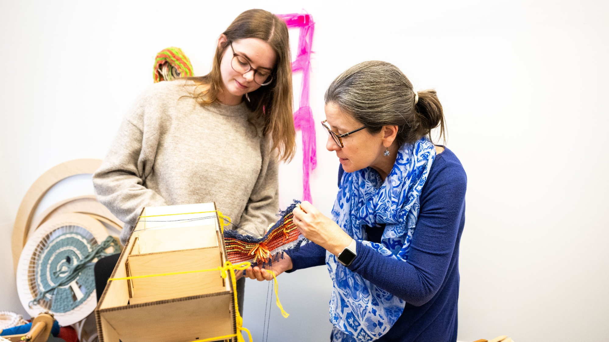Monica teaching undergrad to weave