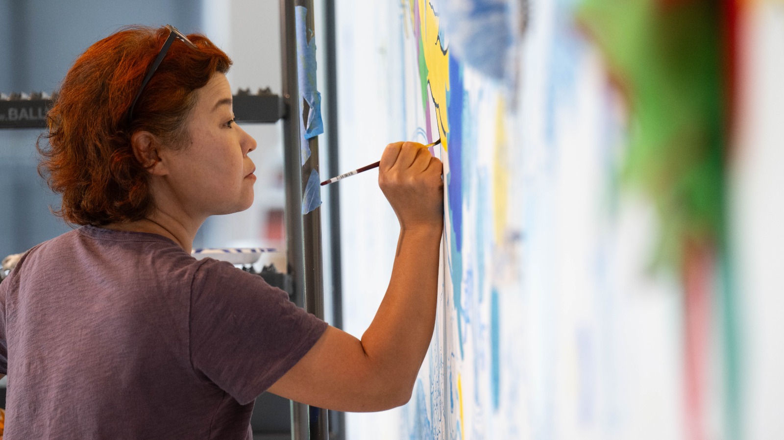 Artist paints a mural