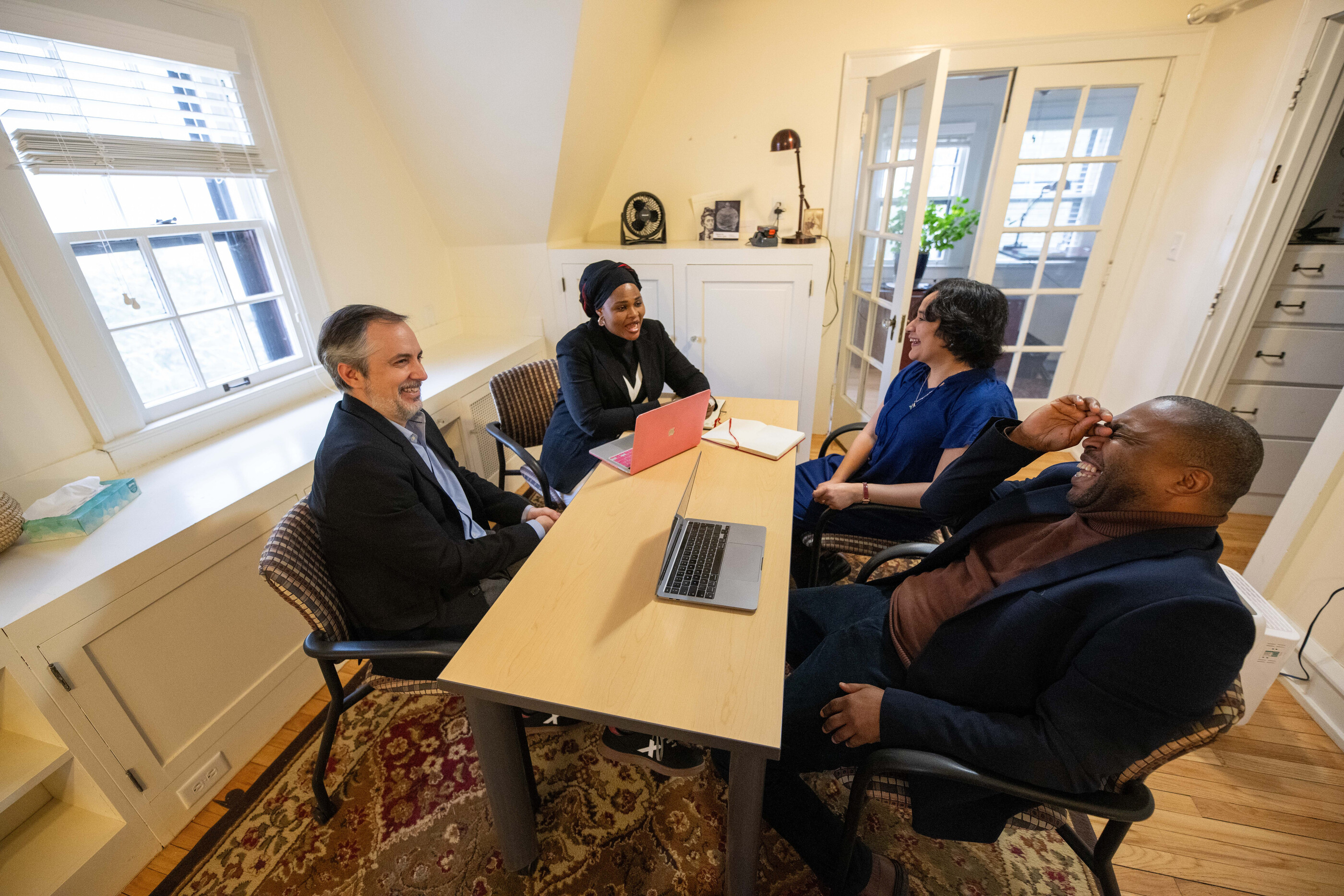 international scholars in discussion in the Obermann Center attic