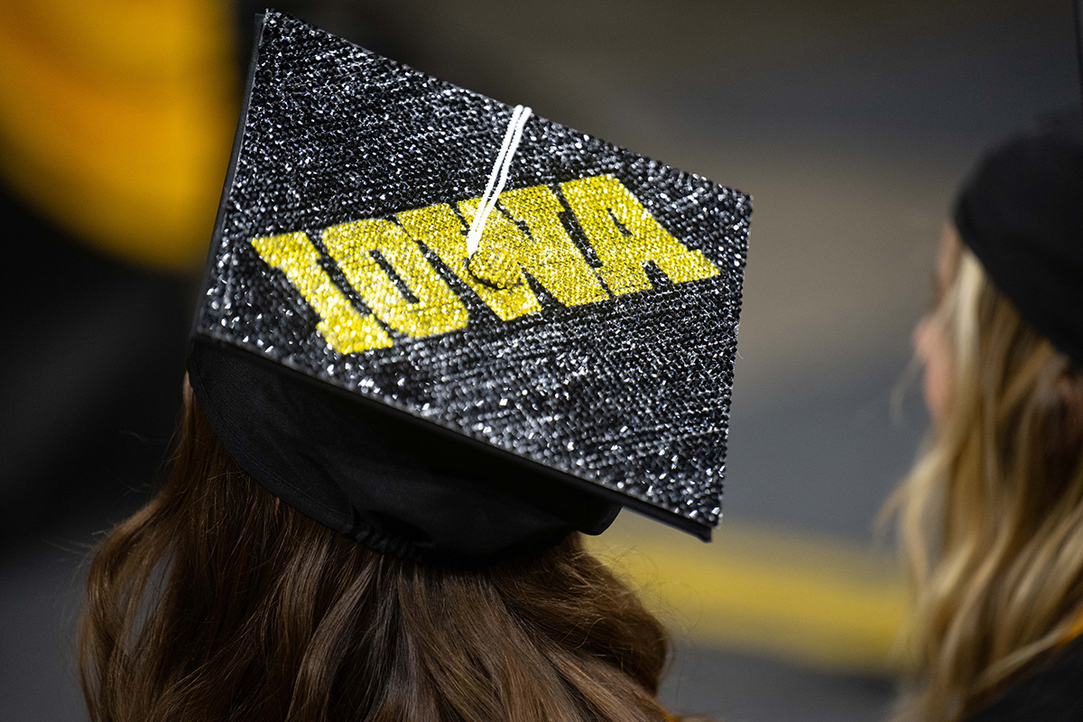 Mortarboard decorated to say Iowa