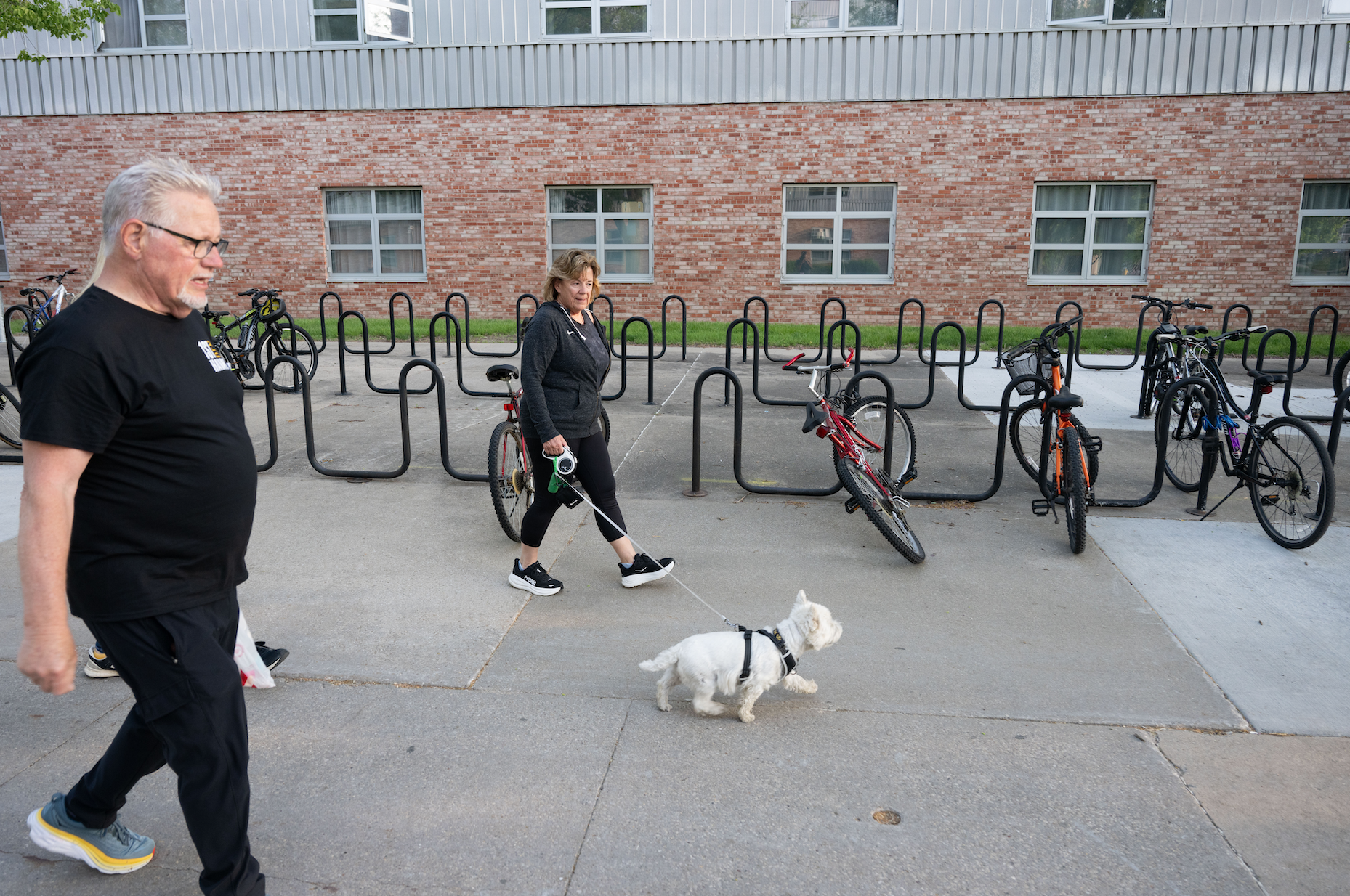 President Barbara Wilson on her daily walk with her husband, John Lammers, and dog, Ollie