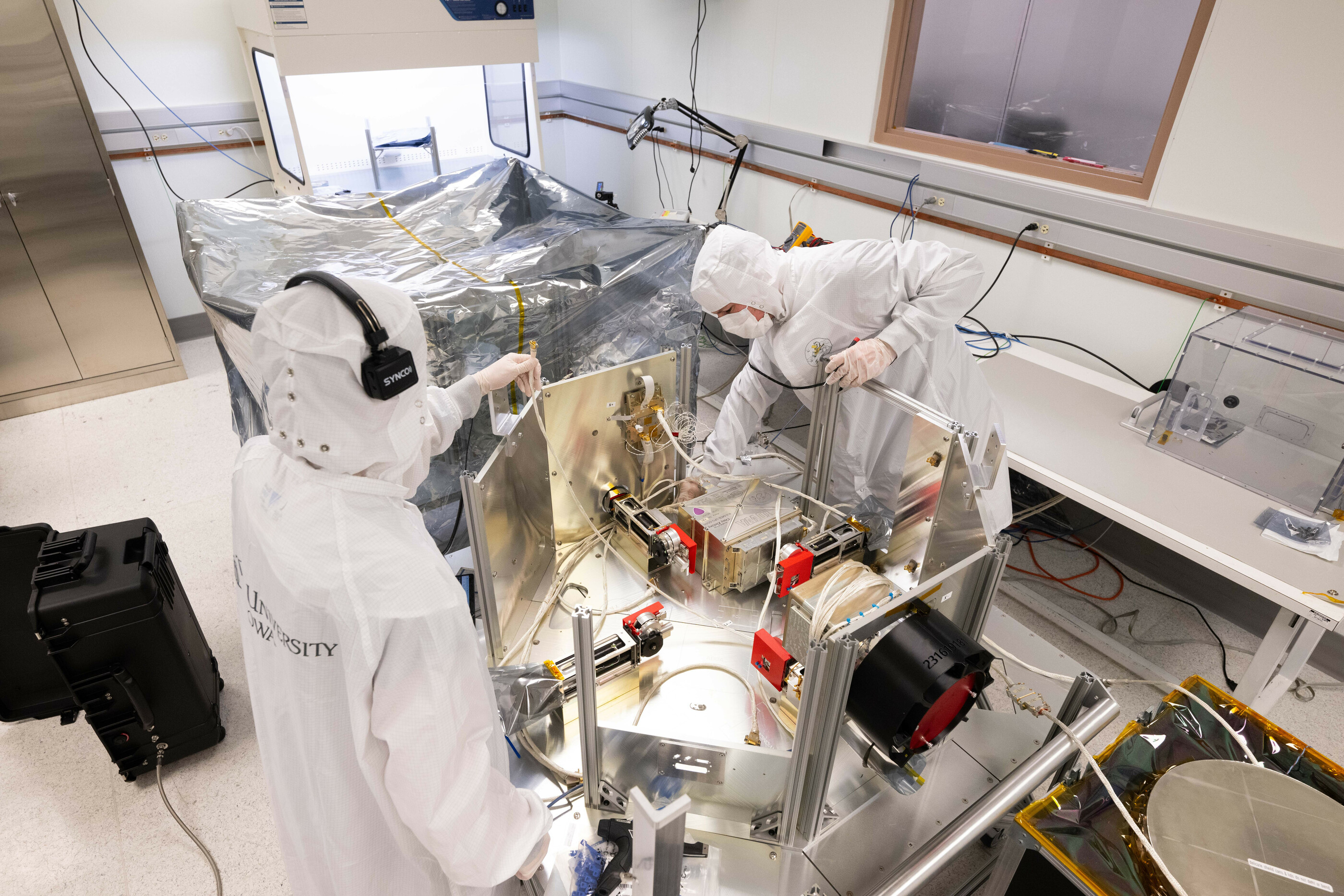 People working on the TRACERS satellites