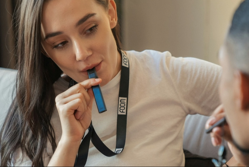Photo of a woman vaping