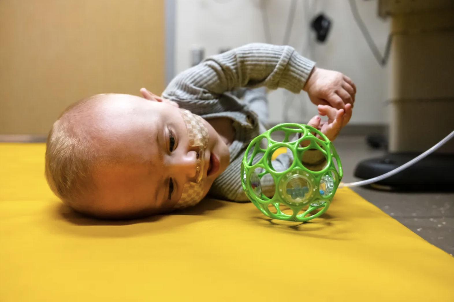 Nash Keen playing with a toy