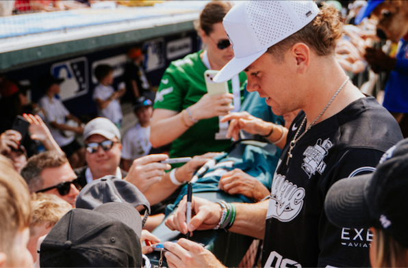 Cooper DeJean signing autographs for fans