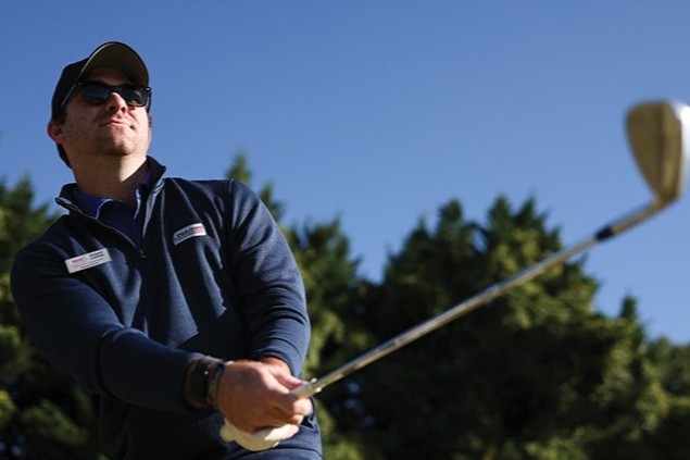 Robert Leahey swinging a golf club. Leahey is reviving the UI Veterans Alumni Group.