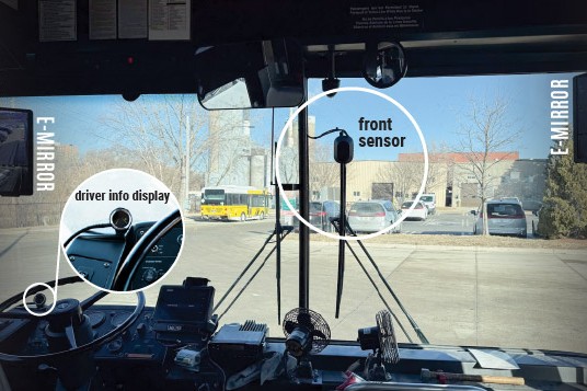 A view of a bus's front windshield showing the new safety equipment being tested.