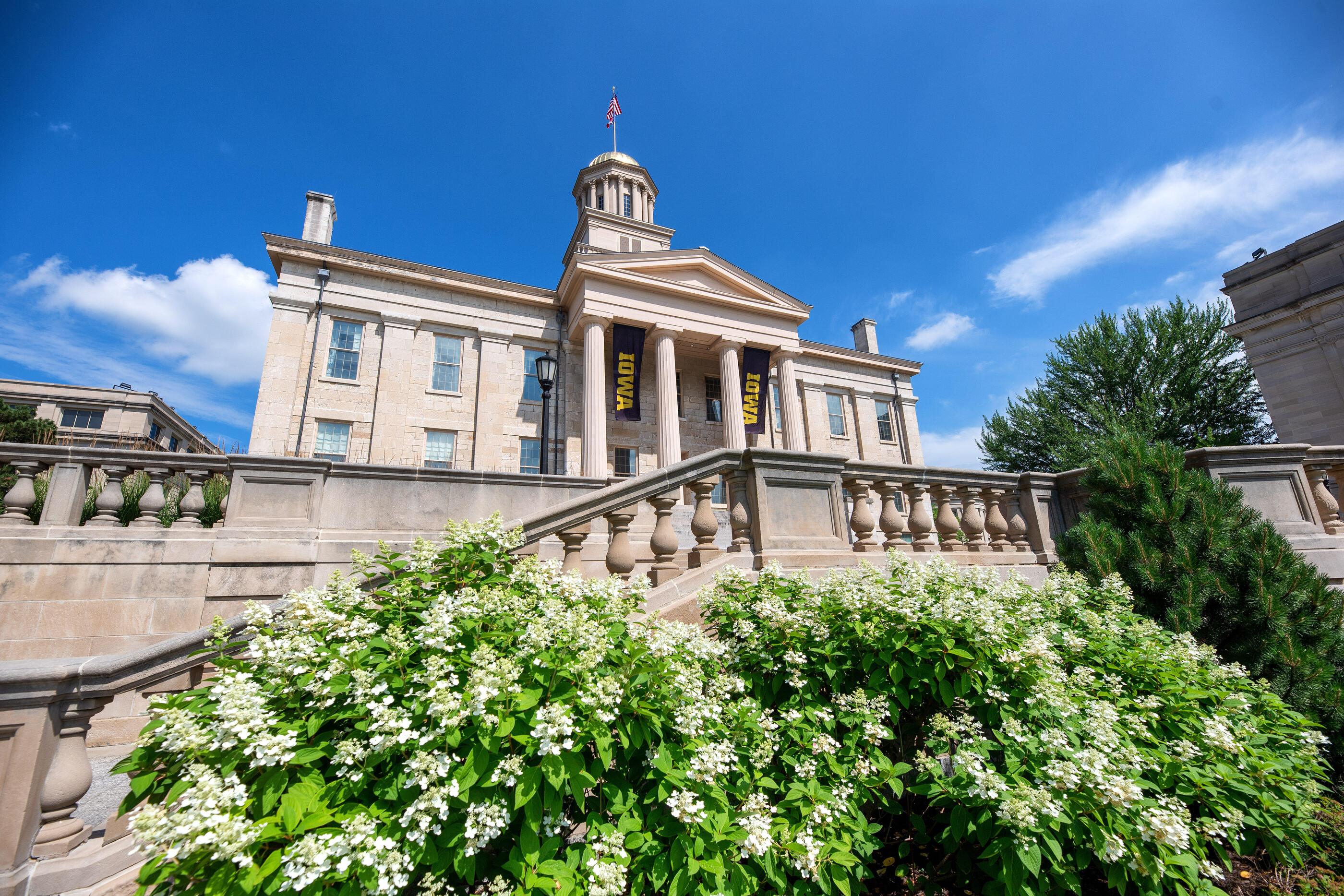 Old Capitol building with flowers in front of it