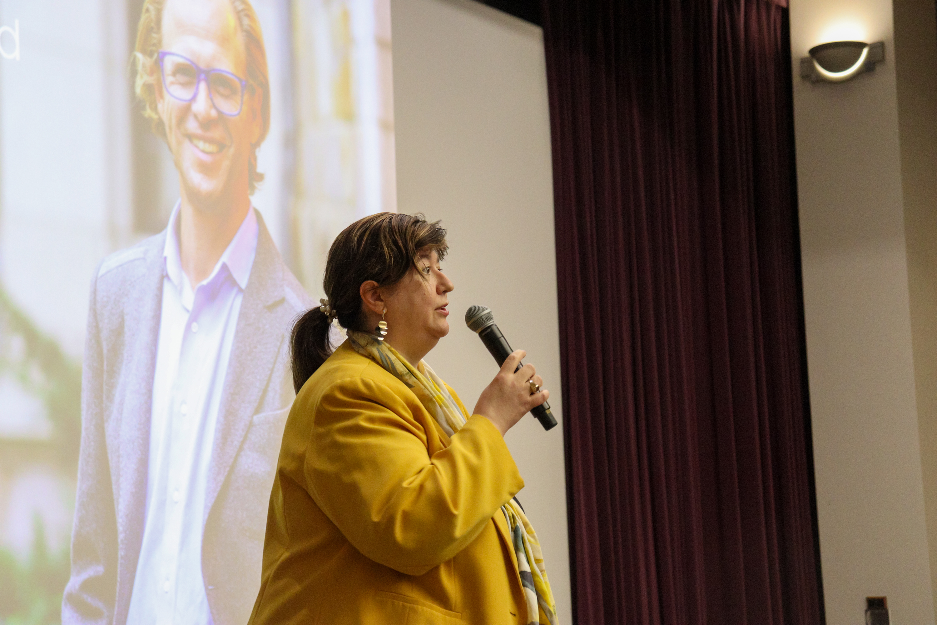 Alexandra Nica speaking into a microphone
