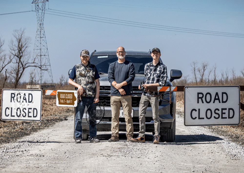 Iowa Raptor Project director Dave Conrads, center, is pictured with volunteers Aaron Petrie, left, and Caden Dorrance at the Hawkeye Wildlife Management Area 