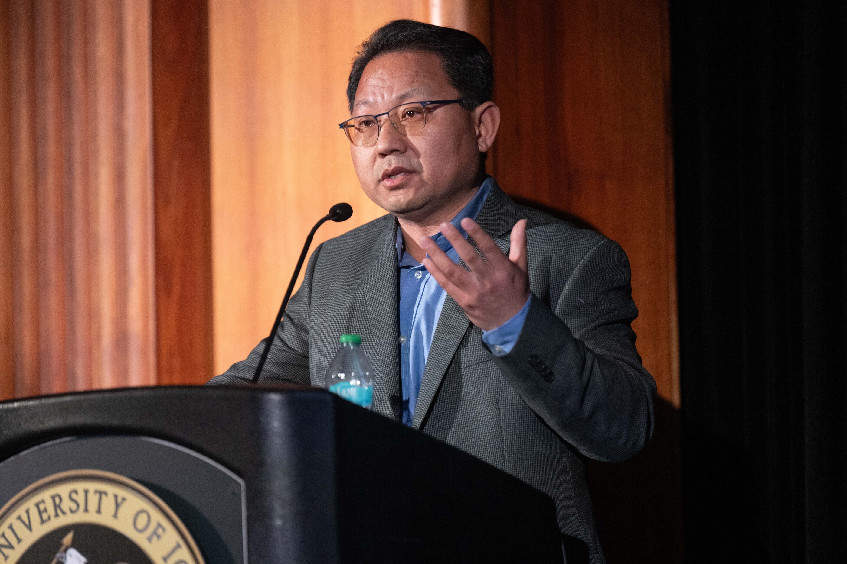 Weiguo (Patrick) Fan at the podium for the 2025 Presidential Lecture series.