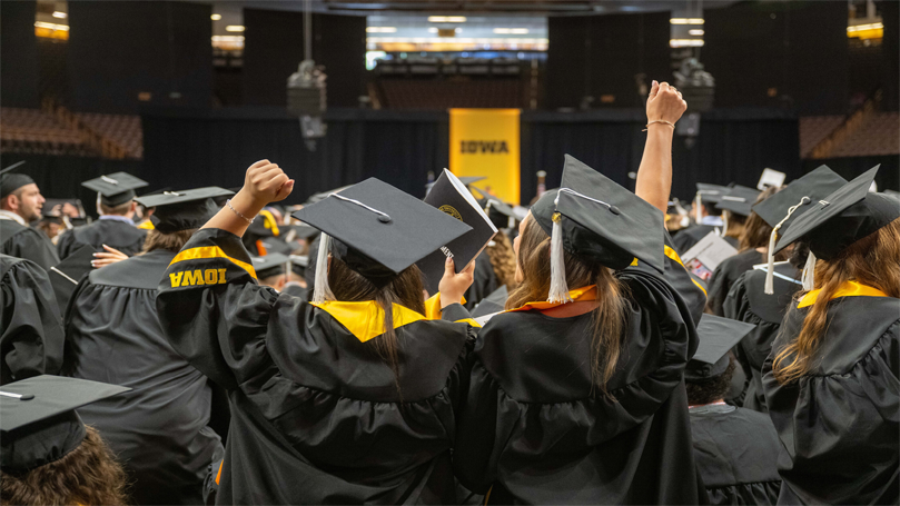 Students cheering at their commencement ceremony